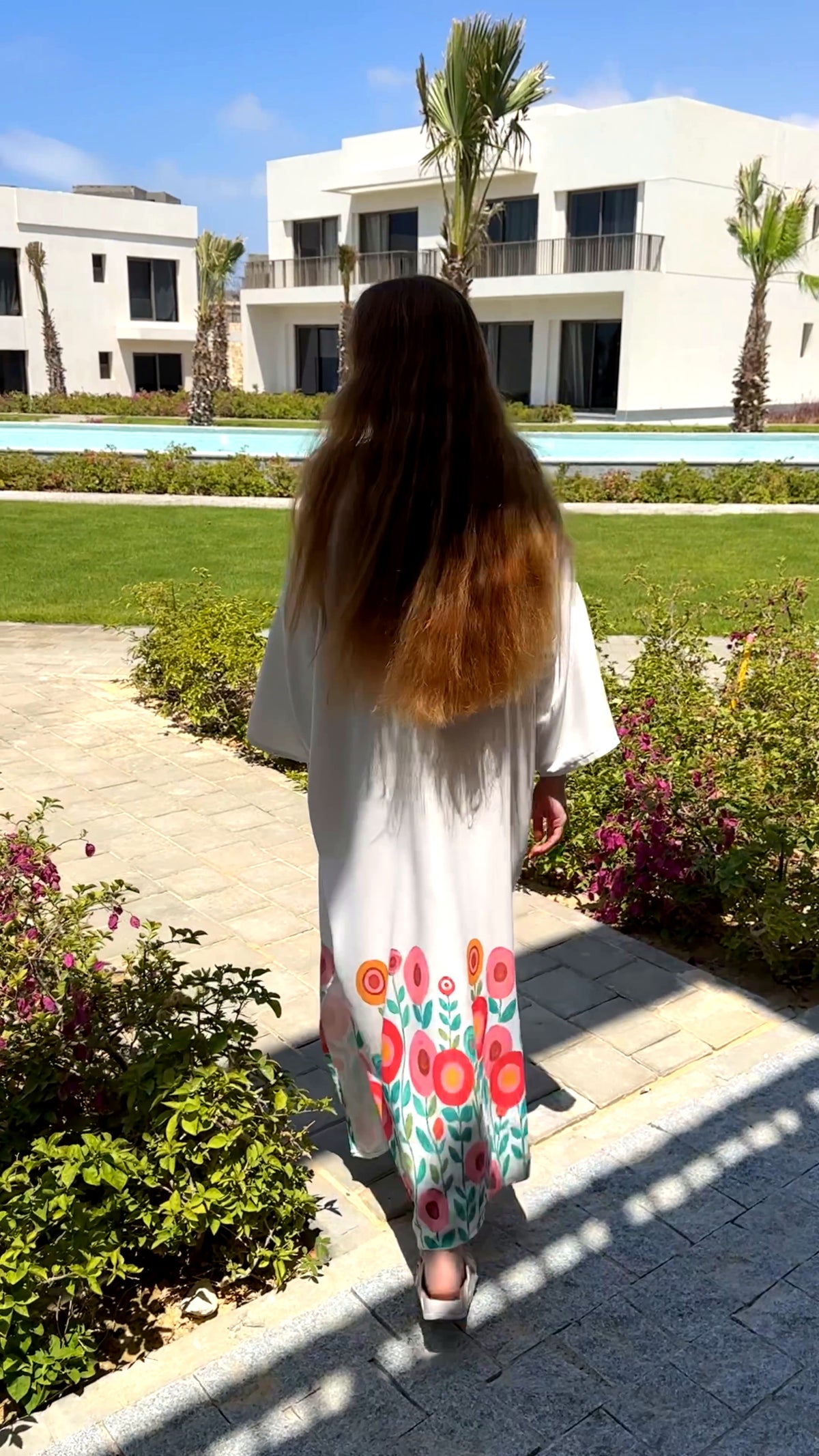 Célora floral kaftan dress, detail of the off-white floral print