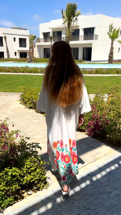 Célora floral kaftan dress, detail of the off-white floral print